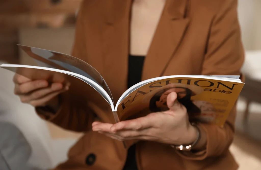 woman reading magazine Print media advertising - Catdi printing Houston